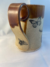 Load image into Gallery viewer, Squash, Butterfly, and Bumblebee ArtPrize Mug - floating orange